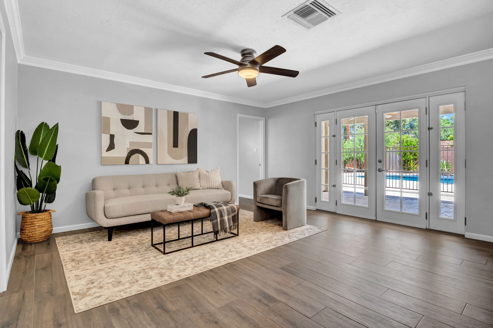 Sitting room with French doors out to the pool deck.